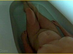 wife gets all wet in the hotel bath with her big tits