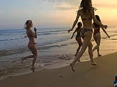 Four Lesbian Girlfriends Rip Clothes and Enjoy Pussies on Beach