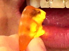 i'm watching fifi foxx eat gummy bears up close with mouth vore