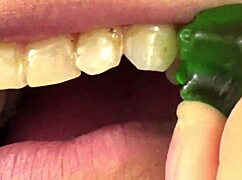 i'm watching fifi foxx eat gummy bears up close with mouth vore