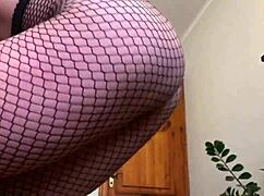 Girl with big tits masturbates in fishnet pantyhose, dripping wet!