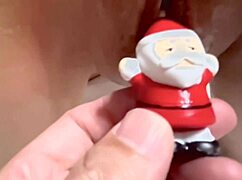 santa claus plays with a wet pussy in this couple's homemade scene