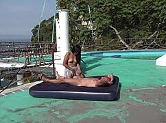 latina couple riding and diving on beach