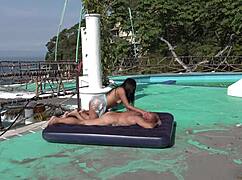 latina couple riding and diving on beach