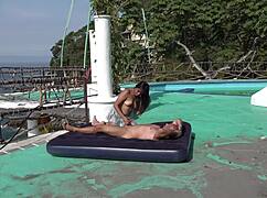latina couple riding and diving on beach