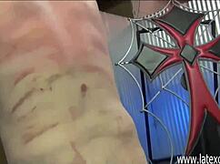 Asian mistress with glasses delivers painful whipping in latex outfit.