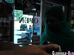 Cocksucking ho receives cumshot at gloryhole.