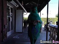 Cocksucking ho receives cumshot at gloryhole.