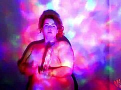 This bbw goddess is dancing and getting oiled up