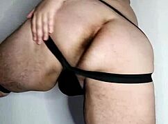 This chubby gay guy is showing off his big ass.