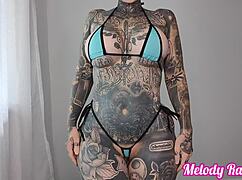 pretty girl tries sheer micro bikini with tattoo and lipstick
