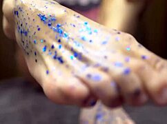 Babe gives sensual footjob to rubber cock