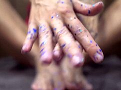 Babe gives sensual footjob to rubber cock