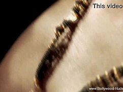 Naked Brunette Teases with Seductive Fire Dance