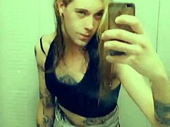 Pretty transsexual in miniskirt and stockings shows off her small cock while masturbating