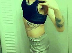 Pretty transsexual in miniskirt and stockings shows off her small cock while masturbating