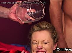 Unusual hottie receives cum shot on face, gulping all the cum in blowbang POV