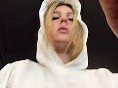 crossdresser gets horny in gym with see-through shirt showing hard nipples