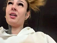 crossdresser gets horny in gym with see-through shirt showing hard nipples