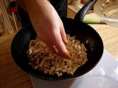 Naked Gay Chef Prepares Rice Noodle with Chicken and Vegetables in Kitchen