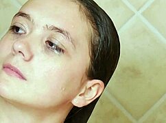 Charming brunette model bathes suggestively on the sofa