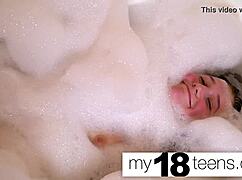 Cute redhead teen masturbates to orgasm in the bath closeup