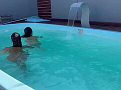 pool party with several young girls flashing balloons outdoors