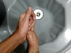 after soccer game amateur guy goes to bathroom to masturbate solo