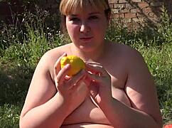 bbw pushes lemon from hairy pussy in outdoor setting