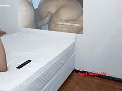 in the office, submissive slave receives a gentle footjob with red toenails caressing his cock