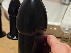 large sextoy stretches redhead's ass wide open