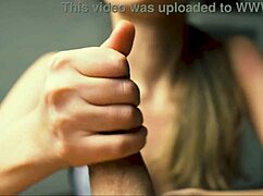 This milf in lingerie moans while giving a handjob to her friend in POV close-up.