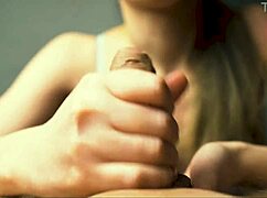 This milf in lingerie moans while giving a handjob to her friend in POV close-up.