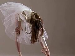 I am a blonde gymnast performing amazing stretches in the gym, but I sometimes mess up my routines.