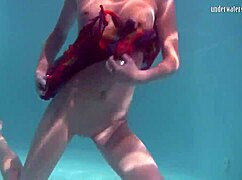 why does redhead b nikita vodorezova get naked so fast underwater on the public beach