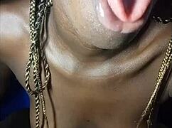 african teen shows off her phat cock sucking lips and drinks cum