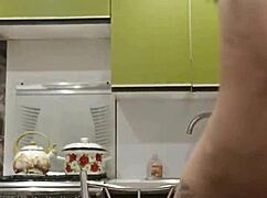 Raven-haired petite 18+ chick rubs and fucks her tight pussy in the kitchen with toys and stockings