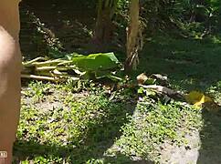 A naked tall girl is photographed in the wild amazon jungle.