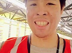 an asian woman casually walking around outdoors during her work shift