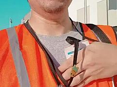 an asian woman casually walking around outdoors during her work shift