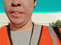 an asian woman casually walking around outdoors during her work shift