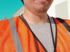 an asian woman casually walking around outdoors during her work shift