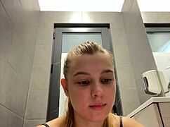 A teen fingers her pussy to orgasm in public outdoor spot