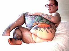 in the dimly lit room, santana red, a tattooed latina with juicy huge ass, shakes her big booty seductively for the camera