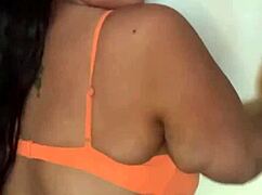 the black pornstar in bikini dances seductively, showing off her big tits and ass