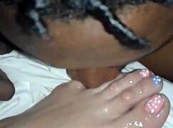 Sucking wife's toes while fucking her passionately.