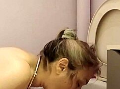 What does the housewife slave do in the toilet?