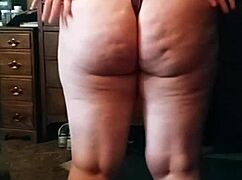 The brunette with a big sexy ass performs an enticing booty drop in the scene.