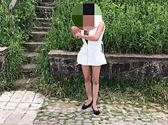 Public Flashing In White Outfit Outdoors