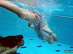 two hot lesbians makin out in the pool underwater